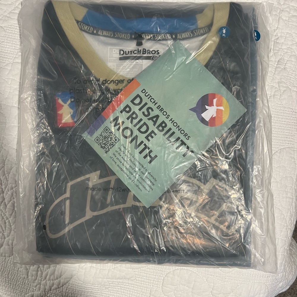 Unopened Dutch Bros jersey pack, comes with T-Shirt.